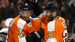 Sean Couturier Celebrating A Victory With Teammate Wallpaper