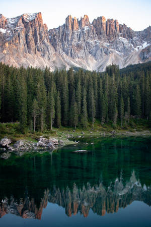 Serene Lake Carezza In Italy Wallpaper