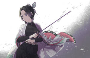 Shinobu From Demon Slayer Bravely Wielding Her Sword Wallpaper