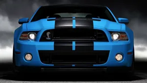 Shiny Blue Car Ready To Ride Wallpaper