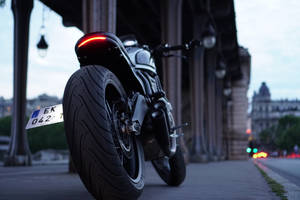 Showing Off Its Power And Beauty, This Black Ducati Turns Heads In The City. Wallpaper