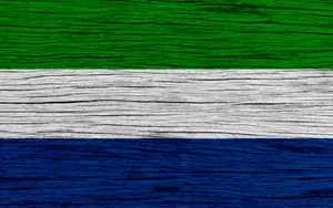 Sierra Leone Flag On Wooden Surface Wallpaper