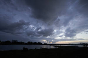 Silhouette Melodramatic Sunset Cloudy Sky Wallpaper