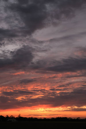 Silhouette Sunset Purple And Orange Cloudy Sky Wallpaper