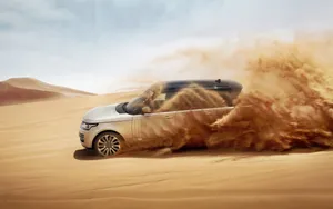 Silver Black Land Rover In Desert Wallpaper