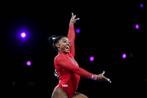 Simon Biles In Red Leotard Wallpaper