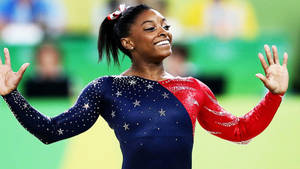 Simone Biles Blue And Red Costume Wallpaper