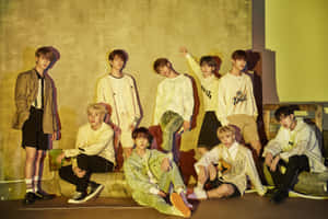 Skz_ Group_ Photo_ Yellow_ Backdrop Wallpaper