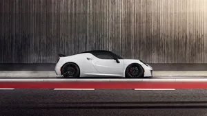 Sleek Alfa Romeo 4c Sportscar In Action Wallpaper