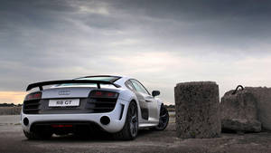 Sleek Audi R8 Coupe In Dynamic Pose Wallpaper