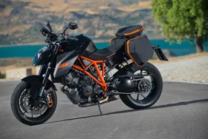 Sleek Black And Orange Ktm Duke 200 Wallpaper