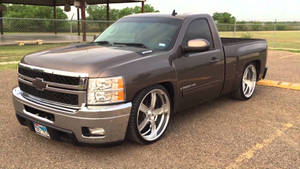 Sleek Dark Gray Dropped Truck Wallpaper