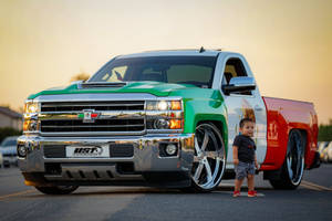 Sleek Dropped Truck Showcasing Luxury And Power Wallpaper