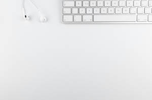 Sleek Keyboard On A White Background Wallpaper