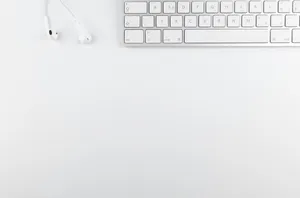 Sleek Keyboard On A White Background Wallpaper