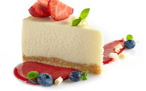 Slice Of Cheesecake With Berries Wallpaper