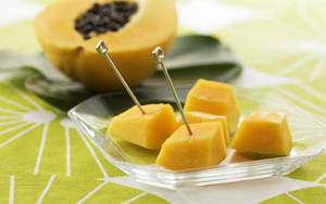 Sliced Papaya In Fruit Picks Wallpaper