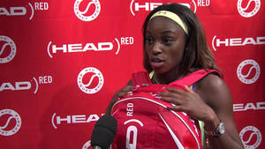 Sloane Stephens Holding Head Bag Wallpaper