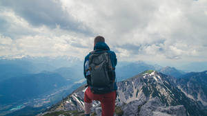 Slovenia Mountain Climber With Backpack Wallpaper