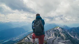 Slovenia Mountain Climber With Backpack Wallpaper