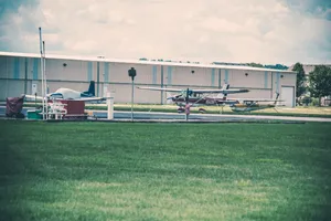 Small Plane On Grass Wallpaper