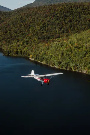 Small Plane Over The Ocean Wallpaper