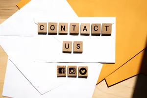 Small Wooden Cubes Displaying 'contact Us' Wallpaper
