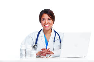 Smiling Physician On Desk Wallpaper