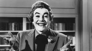 Smiling With Hand Gestures Cesar Romero Wallpaper