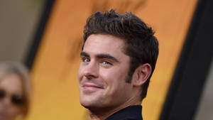 Smiling Zac Efron Wallpaper