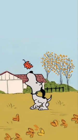 Snoopy Taking A Leafy Fall Stroll Wallpaper