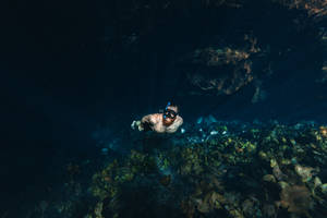 Snorkeling In Dark Waters Wallpaper