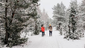 Snowshoeing Couple In Mountain Wallpaper