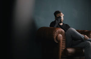 So Sad Man On Couch Wallpaper