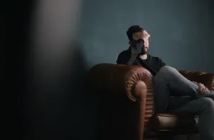 So Sad Man On Couch Wallpaper