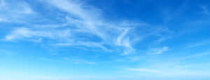 Soar Through Heavenly Blue Skies Wallpaper