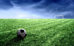 Soccer Ball And Goal Post On Football Field Wallpaper