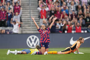 Soccer Celebrationand Disappointmenton Field Wallpaper