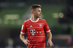 Soccer_ Player_in_ Red_ Striped_ Kit Wallpaper