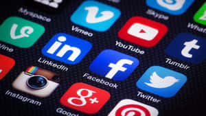 Social Media Apps On Phone Screen Wallpaper