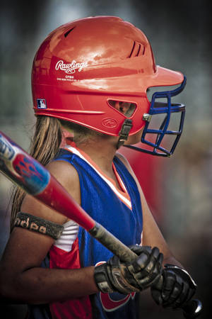 Softball Young Player With Bat Wallpaper