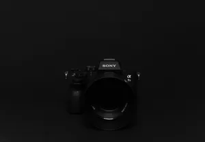 Sony Dslr Camera On Black Desktop Wallpaper