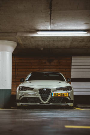 Sophisticated Alfa Romeo In A Parking Lot Wallpaper