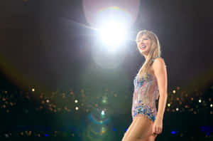 Sparkling_ Performance_ Under_ Spotlight Wallpaper