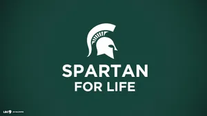 Spartan For Life Logo On A Green Background Wallpaper