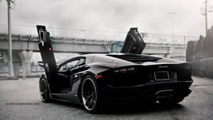 Speed And Style: The Black Lamborghini Aventador Wallpaper