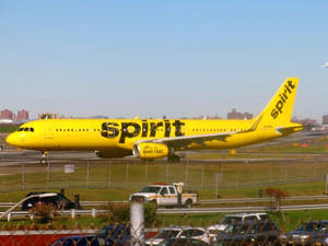 Spirit Airlines Plane Beside A Road Wallpaper