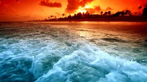Splashing Waves On Beach Sunset Wallpaper