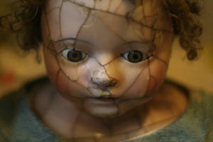 Spooky Damaged Porcelain Doll Wallpaper