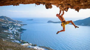 Sport Climbing Hanging Vertically Wallpaper
